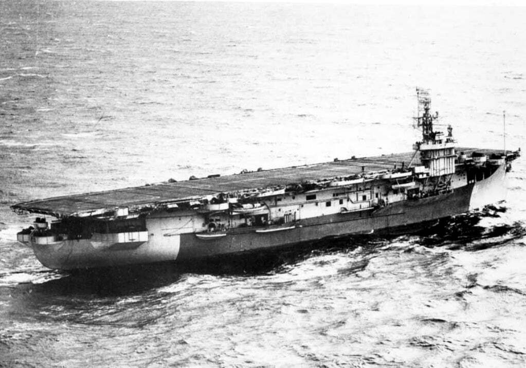 HMS Arbiter underway, in Far Eastern camouflage, 1945