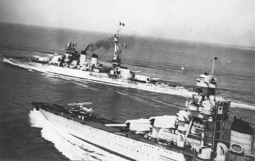 Fiume prepares to launch her IMAM Ro.43 floatplane with battleship Conte di Cavour in the background