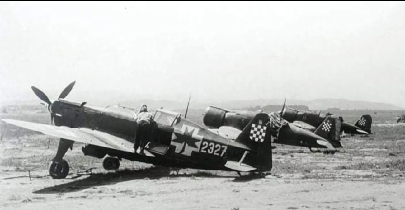 Moraine Saulnier 406 NDH Air Force with two Fiat G.50 fighters in the background