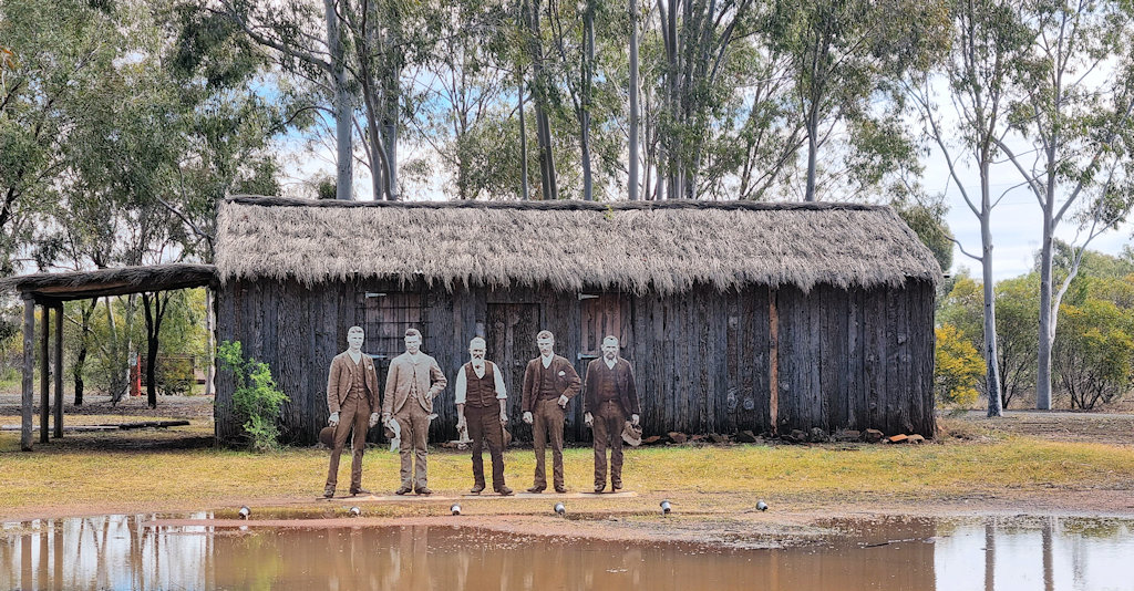 The reconstructed Neeld's Hut. the figures are George Neeld, his three brothers Joseph Ernest and Harry and father Frederick. West Wyalong