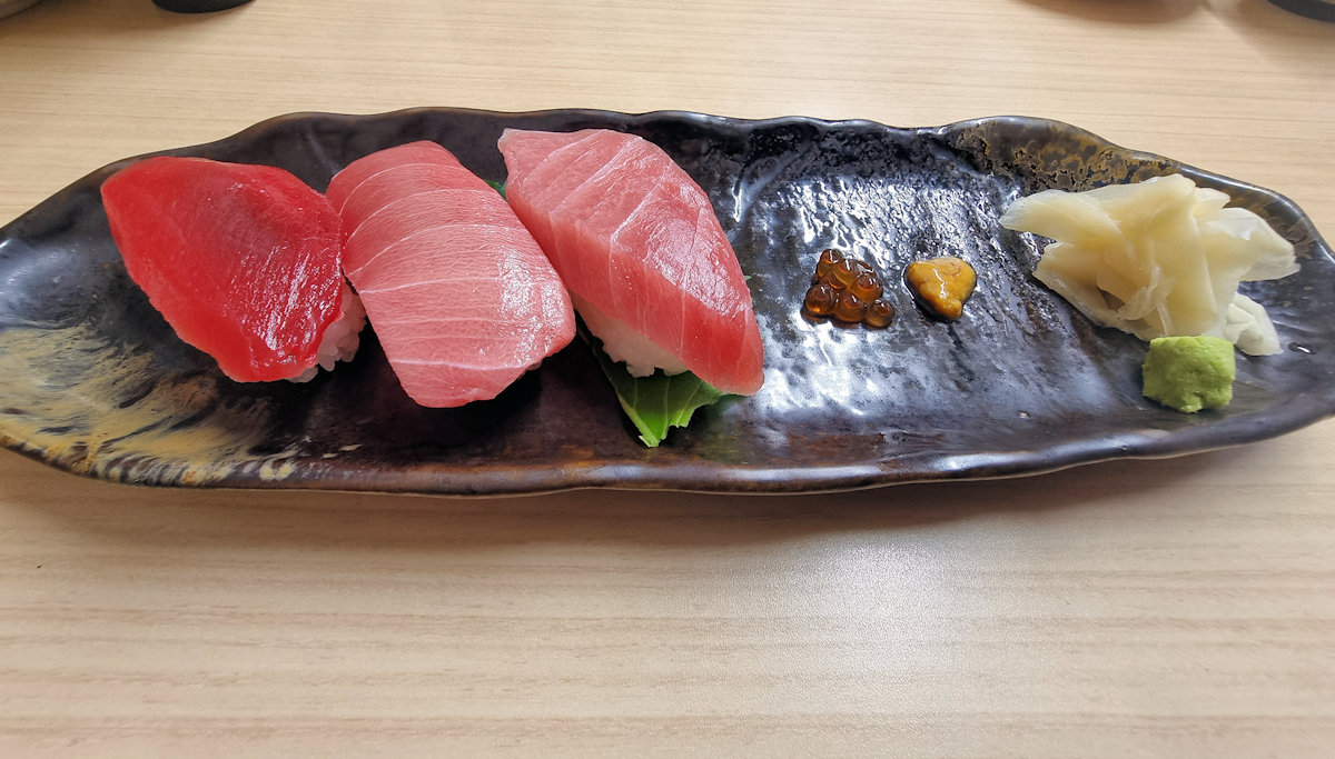 Three different grades of tuna, roe, sea urchin, ginger and wasabi